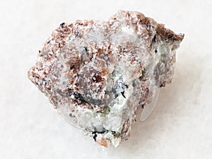 raw Miserite stone on white