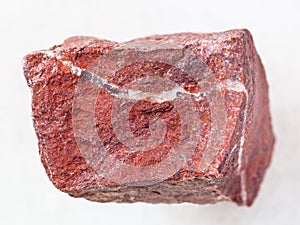 raw red jasper stone on white