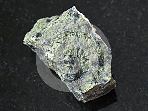 raw serpentinite stone on dark background