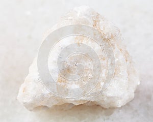 rough anhydrite stone on white photo