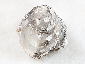 rough cacholong stone on white photo