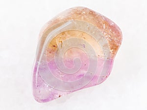 tumbled Ametrine gemstone on white photo