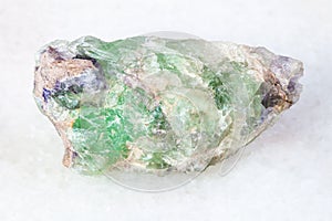 rough green Beryl crystals on white