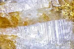 macro shooting of natural rock specimen. Raw crystal of Citrine yellow quartz gemstone from Brazil. Shimmering gold