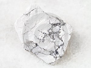 Raw Howlite stone on white photo