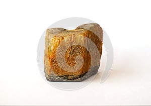 Macro shooting raw tiger eye stone rock isolated on white background.