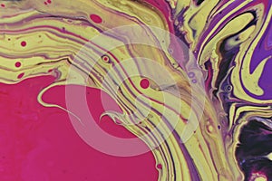 Macro shot of an abstract background of colorful acrylic paint and poured oil mixture