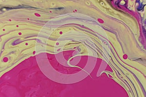 Macro shot of an abstract background of colorful acrylic paint and poured oil mixture