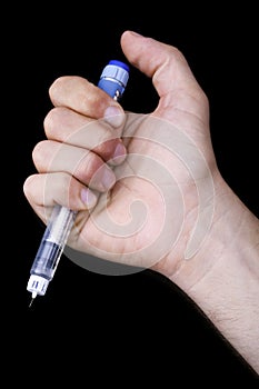 Holding a Penicillin Syringe photo