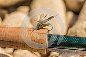 A macro shot of an artificial cicada fly for fishing for trout