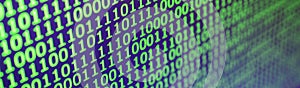 Macro shot of binary code on the monitor of an office computer. The concept of the programmer`s work. The flow of digital informa
