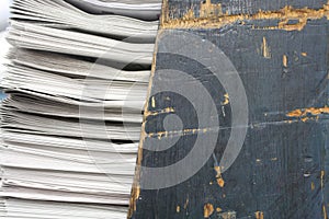 Macro shot of black painted wood texture scratched up newspaper rack