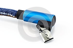 Macro shot of the blue damaged end of the USB 2.0 Micro-B cable, isolated on a white background.