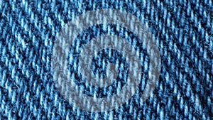 Macro shot of blue denim fabric. Casual wear material. Vintage texture surface