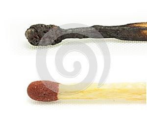 Macro shot of a burnt match head isolated photo