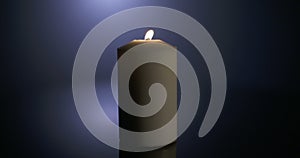 Macro shot of a candle spinning on a dark background