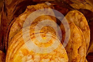 Macro shot of a chip open pack, showing the unhealthy food inside.