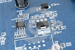 Macro shot of Circuit board with resistors microchips and electronic components background. Computer hardware technology. photo