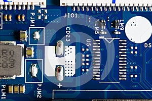 Macro shot of Circuit board with resistors microchips and electronic components. Computer hardware technology. Integrated communic