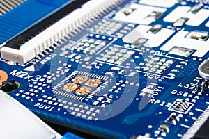 Macro shot of Circuit board with resistors microchips and electronic components. Computer hardware technology. Integrated communic