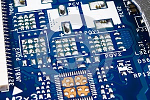 Macro shot of Circuit board with resistors microchips and electronic components. Computer hardware technology. Integrated communic