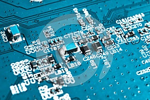 Macro shot of Circuit board with resistors microchips and electronic components. Computer hardware technology. Integrated communic