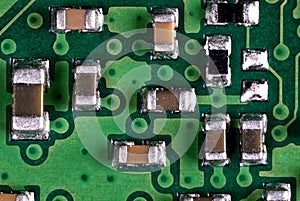 Macro shot of a circuitboard with resistors and capacitors