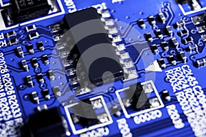 Macro shot of a Circuitboard with resistors microchips and electronic components. Computer hardware technology. Integrated communi