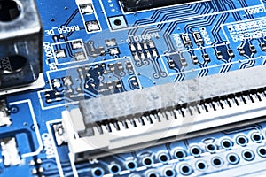 Macro shot of a Circuitboard with resistors microchips and electronic components. Computer hardware technology. Integrated communi