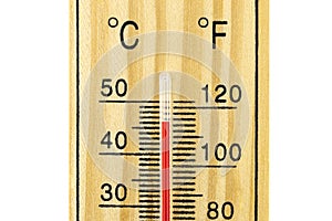 A macro shot of a classic wooden thermometer showing a temperature of 46 degrees Celsius, 114.8 degrees Fahrenheit, isolated on a