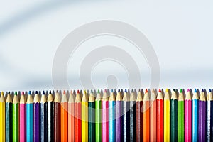 Macro shot of color pencils on white background