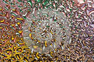 Macro shot of colorful water drops on glass. Abstract background
