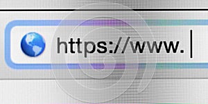 Macro shot of computer screen with https:// address bar and web