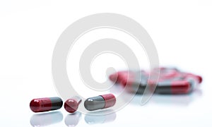 Macro shot detail selective focus of red and grey capsule pills