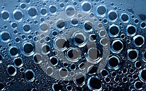 Macro shot detail of water drops with unique pattern. Water drops texture background. Round shape of droplet on dark background.