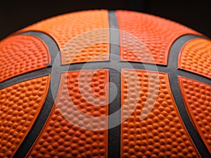 Macro shot. Details of a basketball ball on a black background. Sports, sports games, champions league, training, hobby,