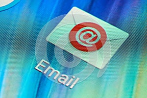 Macro shot of email mobile application icon on Android phone screen. Common emailing app