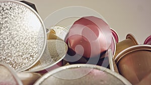 Macro shot of espresso capsules in various colors and flavors