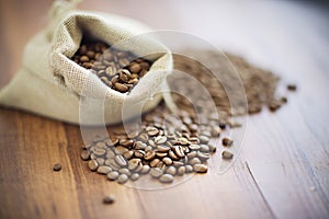 macro shot of fresh coffee beans in a burlap sack