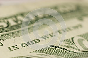 Macro shot of IN GOD WE TRUST, fine focus on GOD