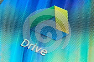 Macro shot of Google Drive mobile application icon on Android phone screen. Google Drive is one of the most popular applications