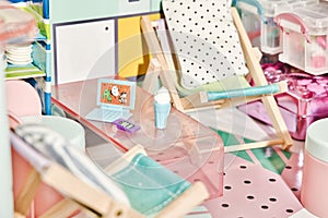 Macro shot of a living room with tables and chairs in a dollhouse