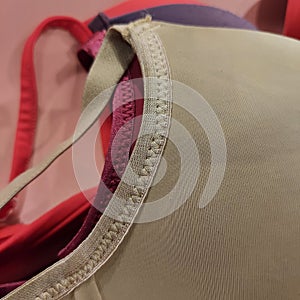 Macro shot of luxury elegant women underwire push up bras in different colors and sizes and styles.