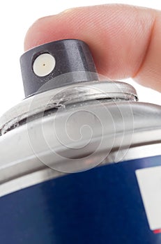 Macro shot of a male hand holding a spray can