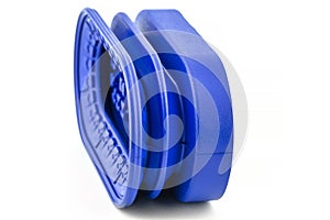 Macro shot of a new, blue bellows suction cup used in the robotic industry, isolated on a white background.