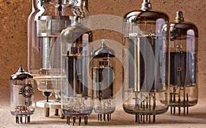 Macro shot of old radio lamps on kraft paper background.