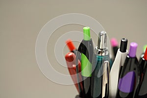 Macro shot of pens and pencils in an office setting