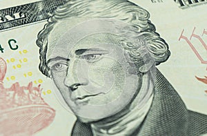 Macro shot Portrait of Alexander Hamilton on the one ten dollar bill. Background of the money. 10 dollar bill with Alexander