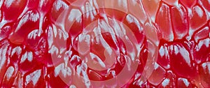 Macro shot of red pomelo pulp texture background.