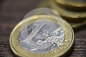 Macro shot of a scratched single Euro coin.